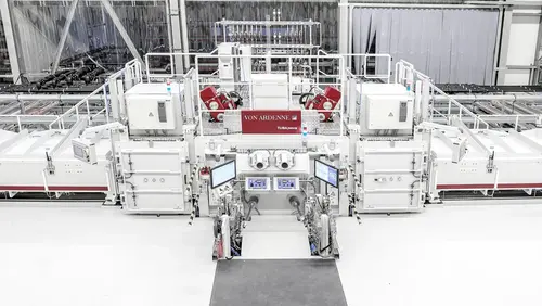 This image shows a VON ARDENNE turbine blade coating system TUBA with electron beam guns
